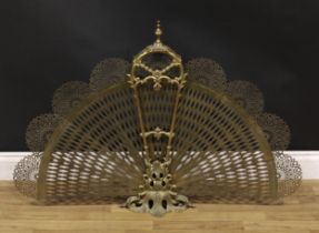 A Louis XV style gilt metal fan fire guard, pierced and cast with leafy scrolls, 75cm high, 109cm