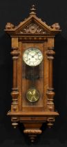 A late 19th century walnut architectural Harmonia Vienna type wall clock, 13cm circular dial