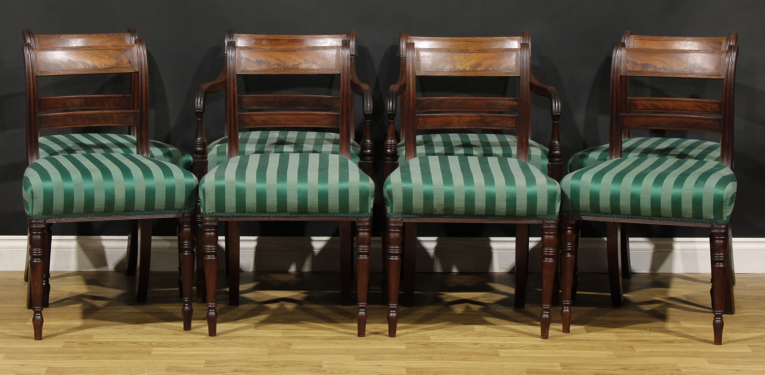 A set of eight Post-Regency mahogany bar-back dining chairs, comprising six side chairs and a pair