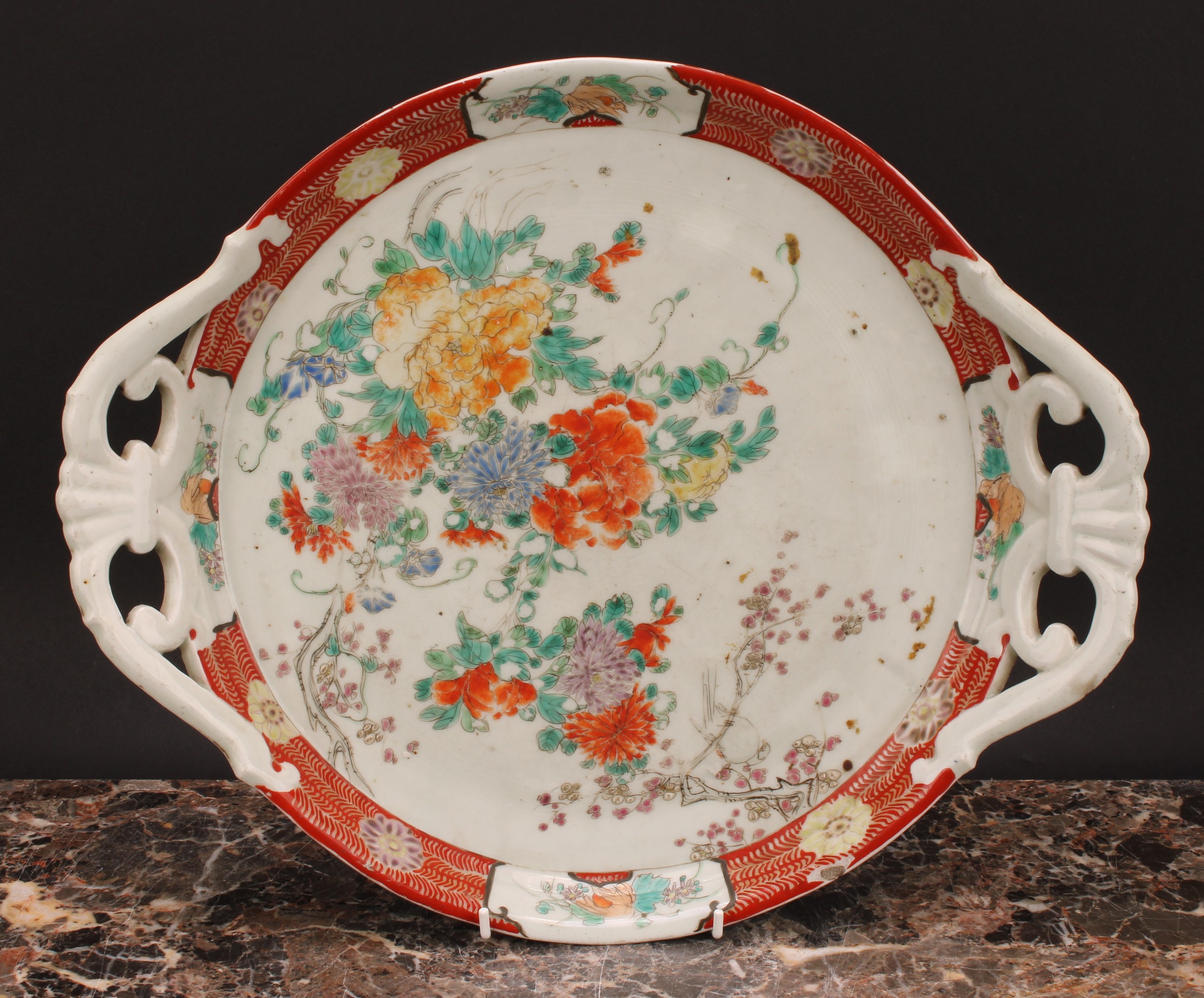 A Japanese two-handled circular tray, painted in polychrome with flowers, 41cm wide, Meiji period - Image 2 of 3