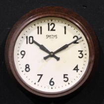 A mid-20th century Bakelite wall timepiece, 22cm circular clock dial inscribed SMITHS 8 DAY MADE