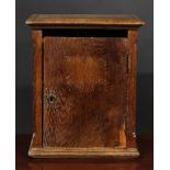 A 19th century French Provincial oak chateau post box, letter aperture above a rectangular door,