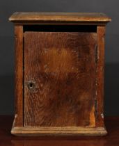 A 19th century French Provincial oak chateau post box, letter aperture above a rectangular door,