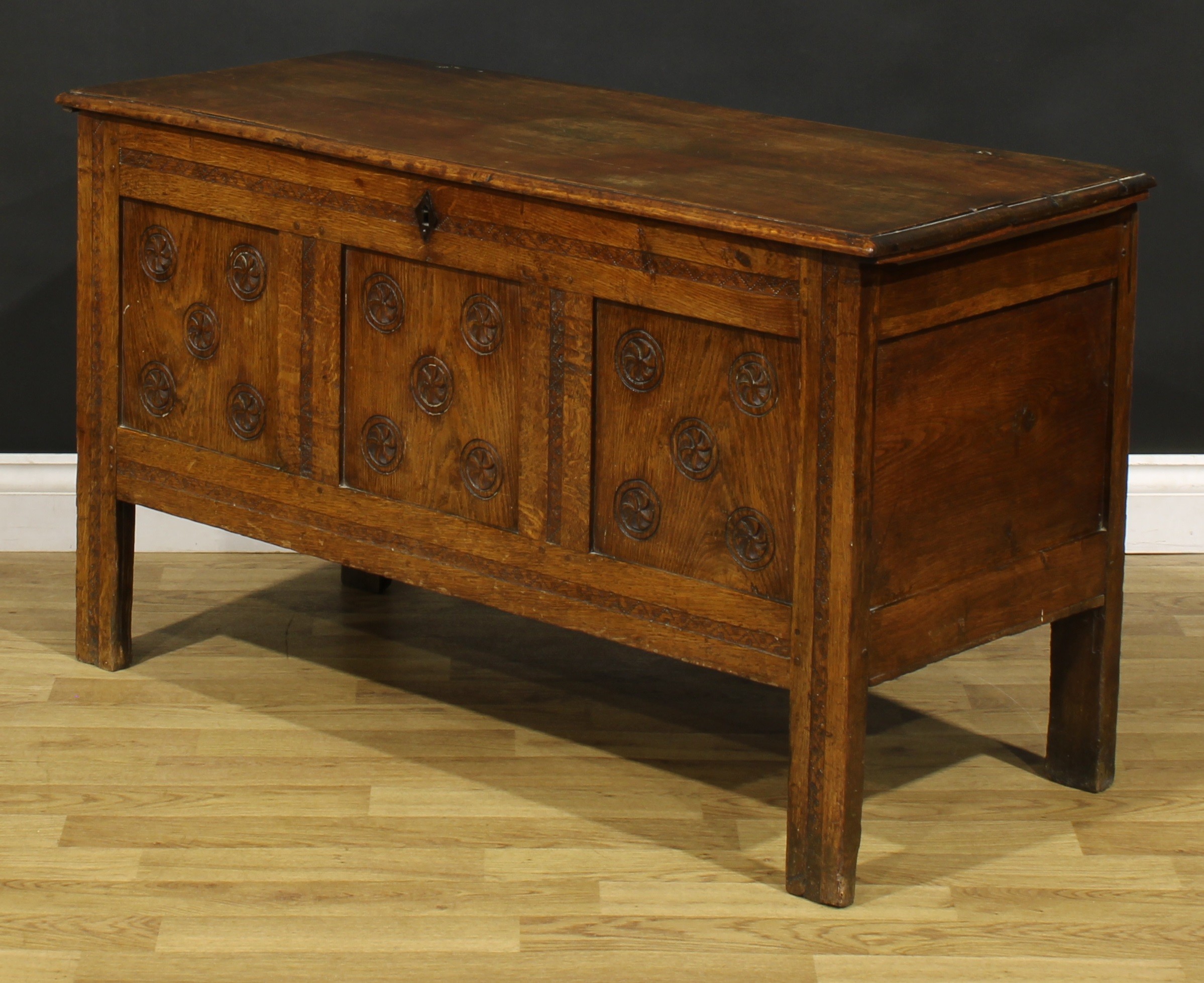 An 18th century oak blanket chest, hinged top enclosing a till above a three panel front, carved - Image 4 of 5