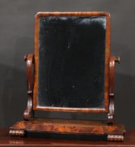 A William IV flame mahogany dressing glass, rounded rectangular mirror plate, break-centre base,