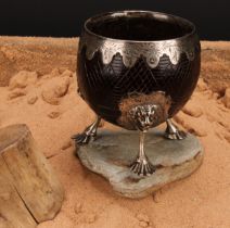 A George III silver mounted coconut cup, the fittings engraved with leafy stems, on a hatched