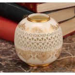 A Royal Worcester ovoid reticulated vase, by George Owen, outlined with gilt bands of scrolls and