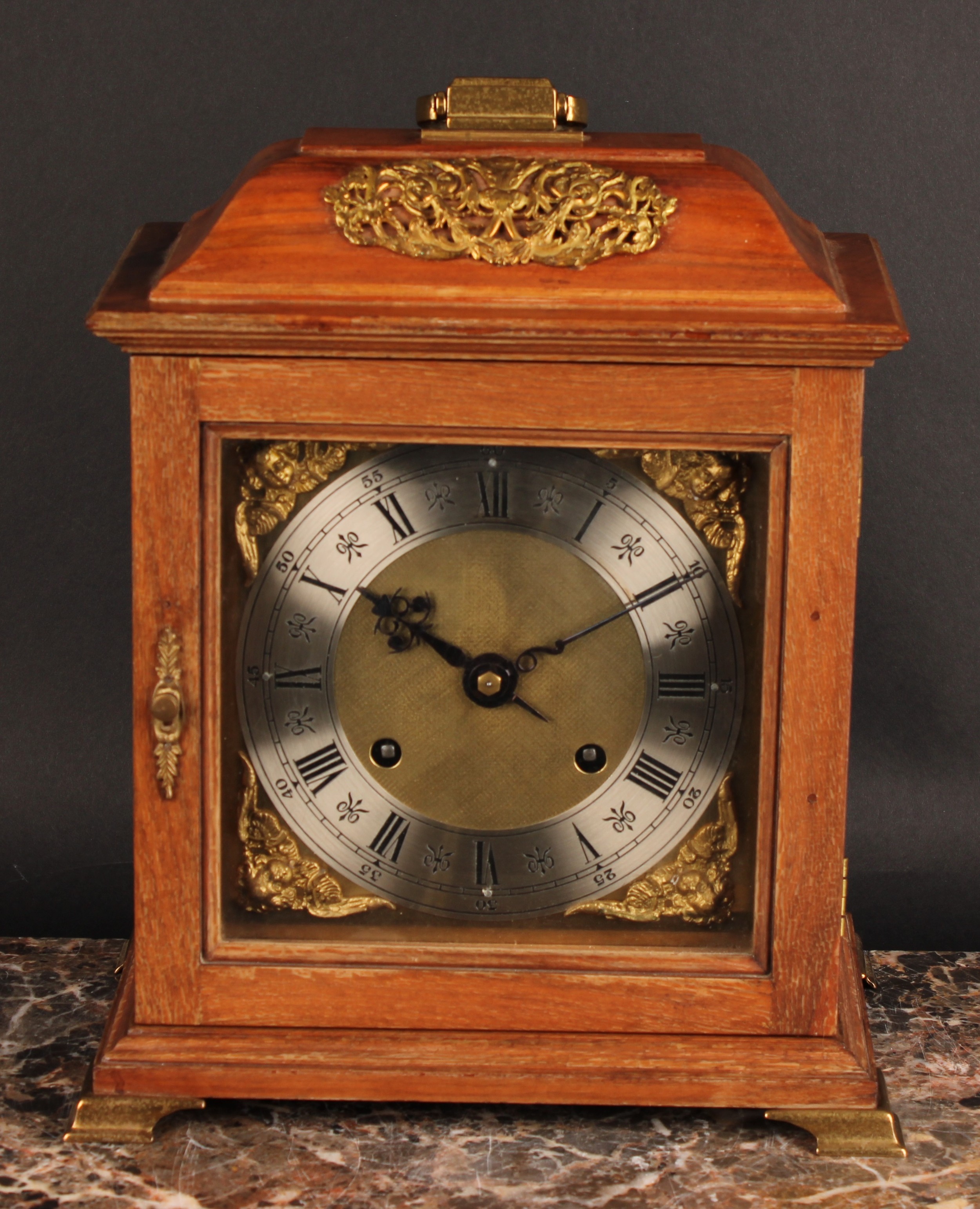 An early to mid 20th century walnut bracket-form mantel clock, 17.5cm brass dial with silvered