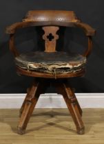An Arts & Crafts oak swivel desk chair, possibly James Shoolbred and Co, 79.5cm high, 62.5cm wide,