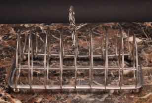 A George IV silver rounded rectangular nine-bar toast rack, of Scottish interest, leafy-loop handle,
