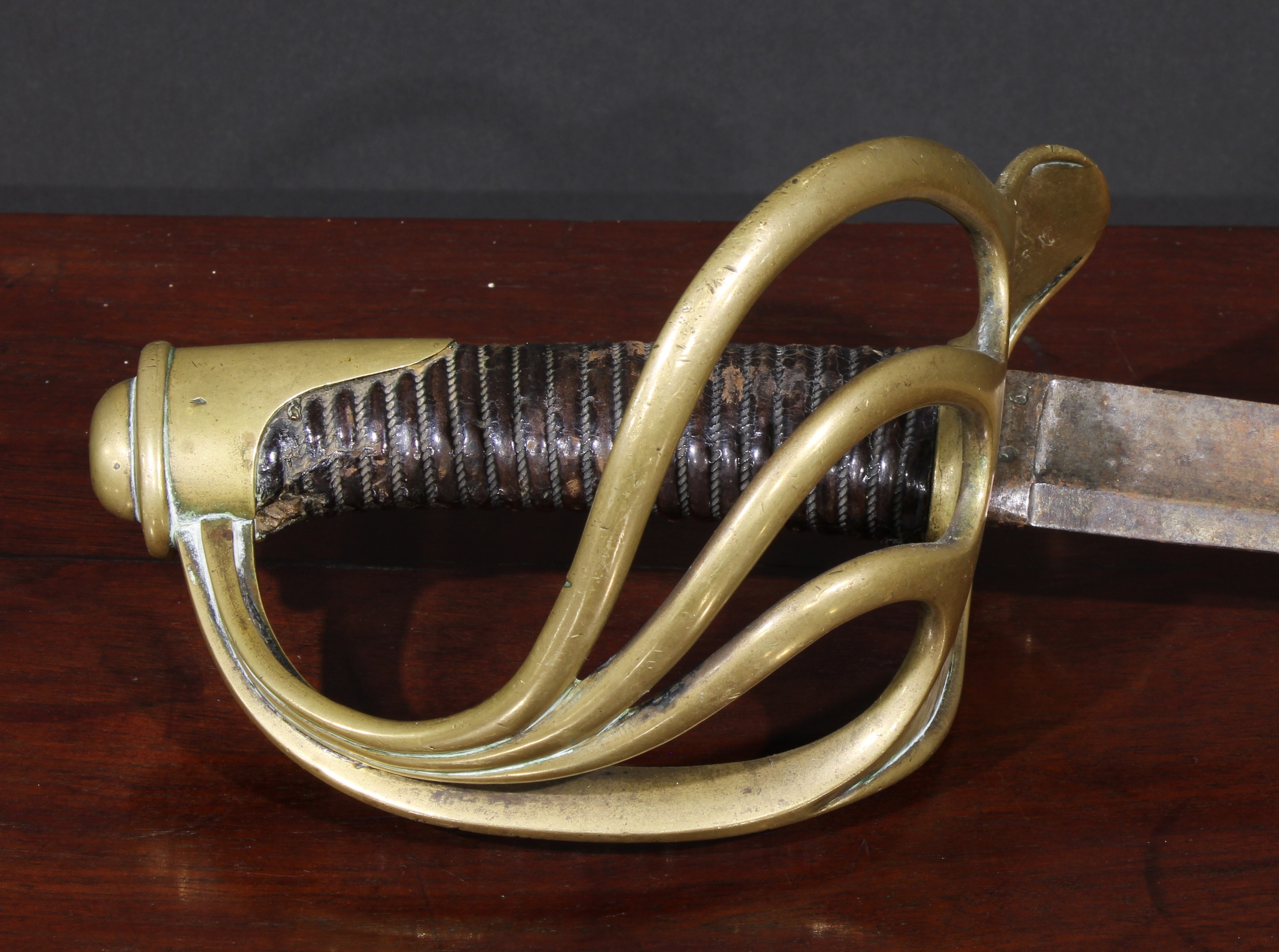 A 19th century French cavalry sword, 97.5cm curved fullered blade, brass hilt with armourer’s marks, - Image 3 of 3