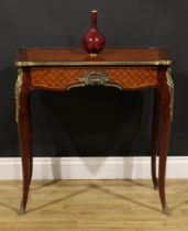 A Louis XV style parquet de Versailles room centre table, shaped hipped rectangular top above a long