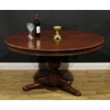 A 19th century mahogany centre table, possibly Irish, circular tilting top with reel moulded edge,