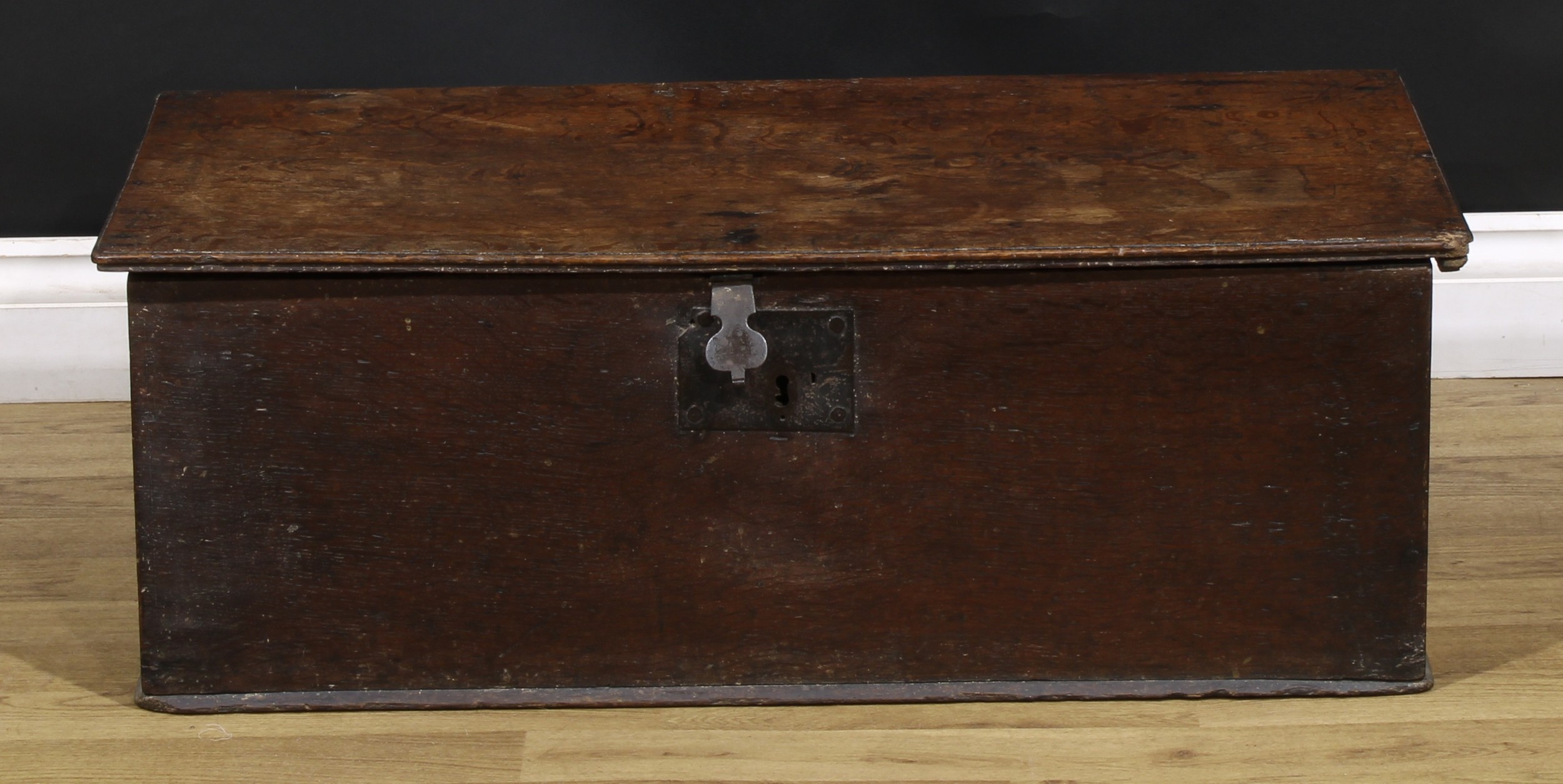 An 18th century oak six-plank boarded table box, hinged top, iron hasp and lock plate, 30cm high,