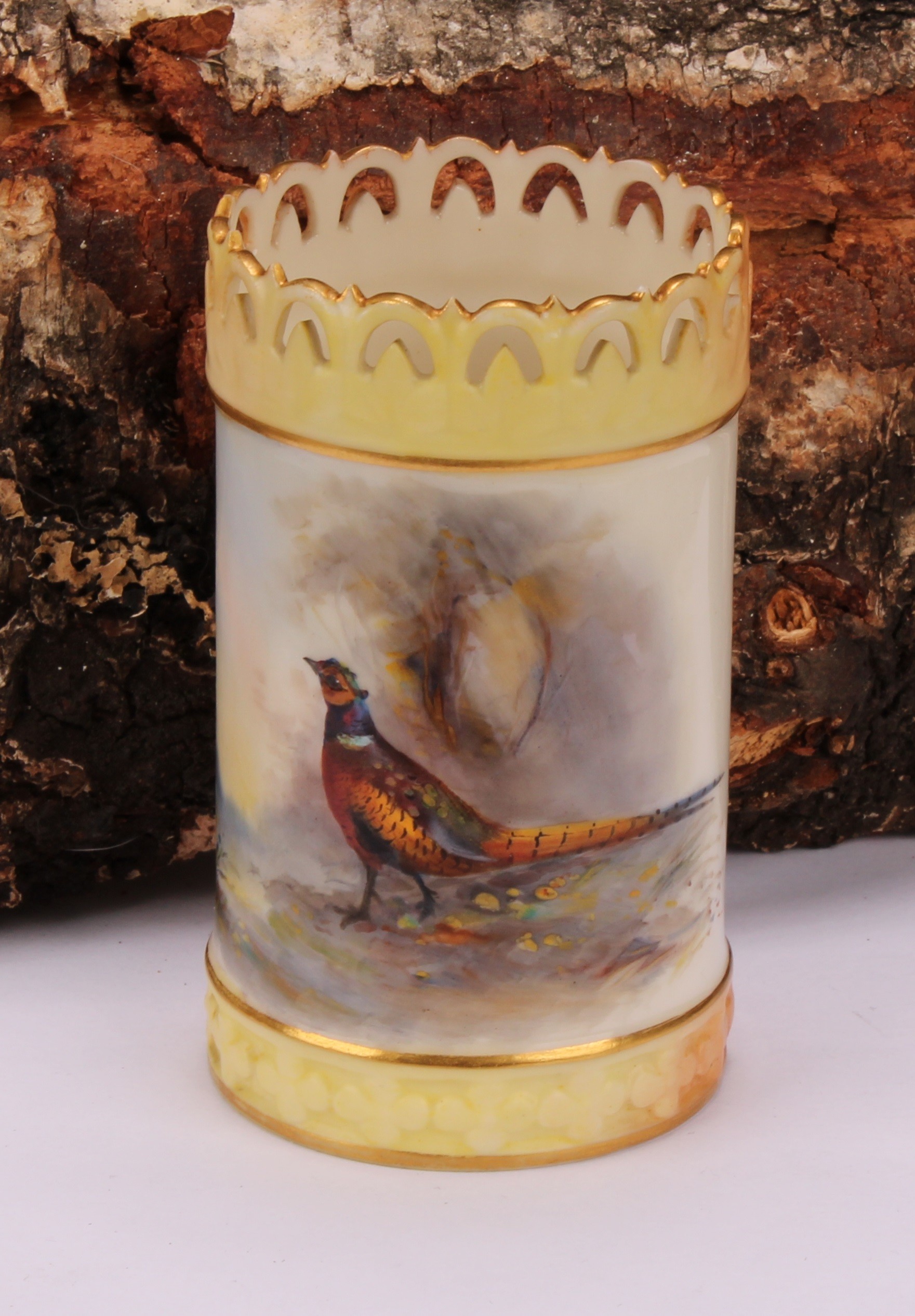 A Royal Worcester cylindrical vase, painted by Jas Stinton, signed, with pheasant in a landscape,