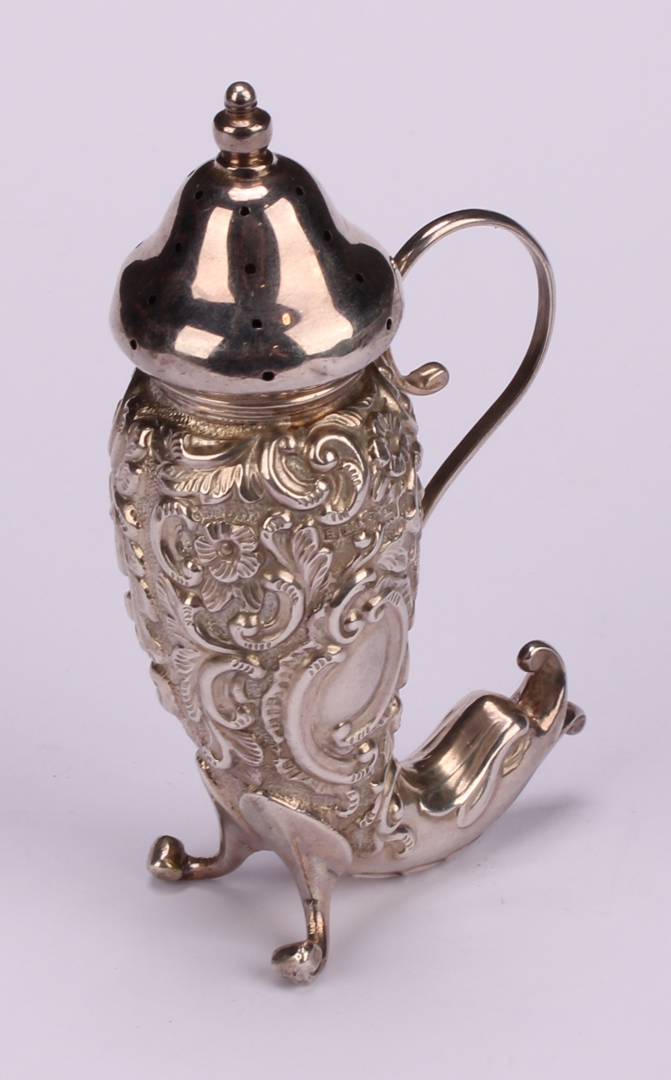 An Edwardian silver pepper, embossed with flowers and scrolling foliage, terminating in a dolphin, - Image 3 of 9