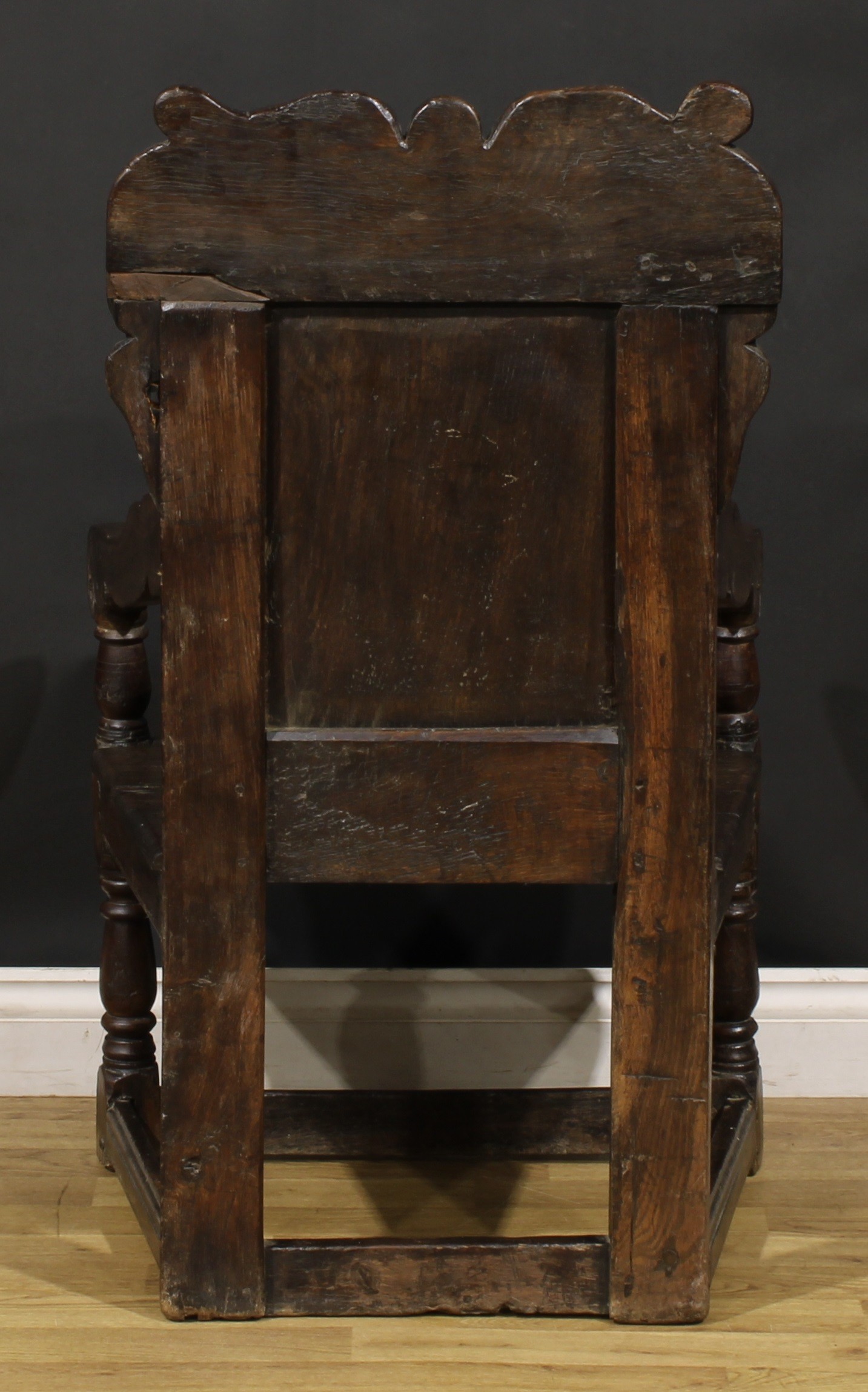 A 17th century oak wainscot armchair, shaped cresting carved with scrolling leafy branches, the - Image 4 of 4