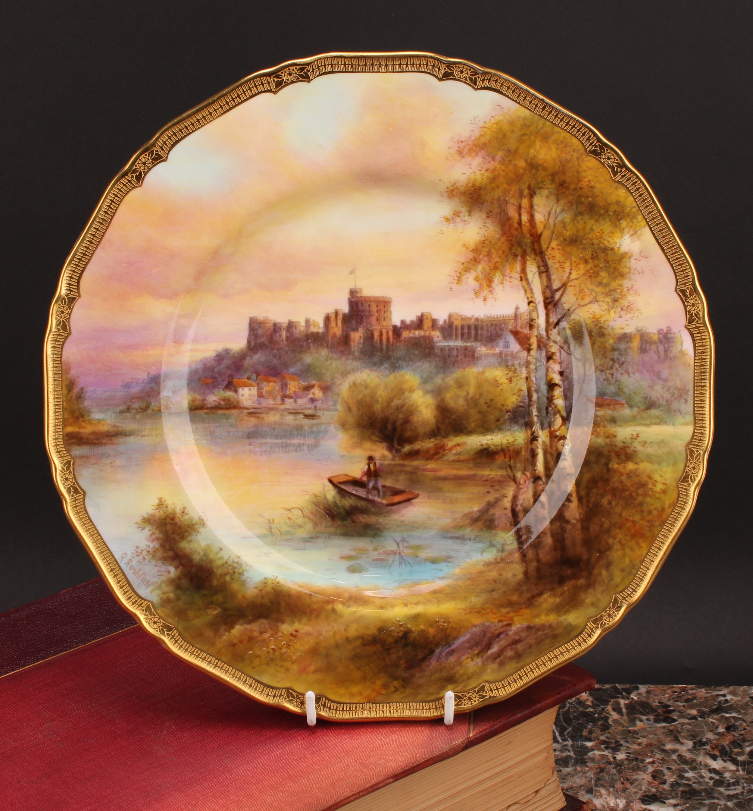 A Royal Worcester Named View shaped circular plate, painted by R. Rushton, signed, with a view of