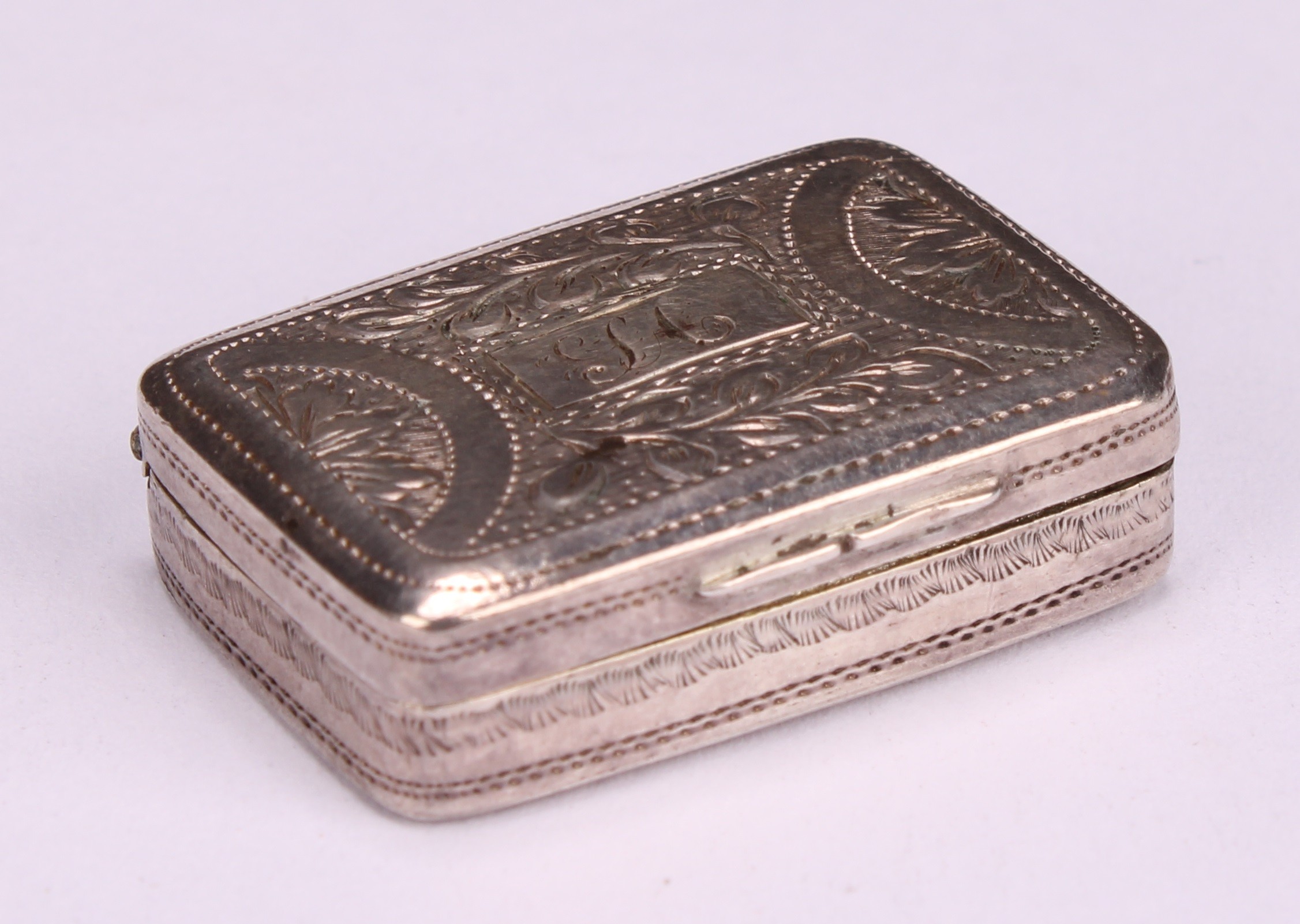 A George III silver rounded rectangular vinaigrette, hinged cover bright-cut engraved with stiff - Image 3 of 7