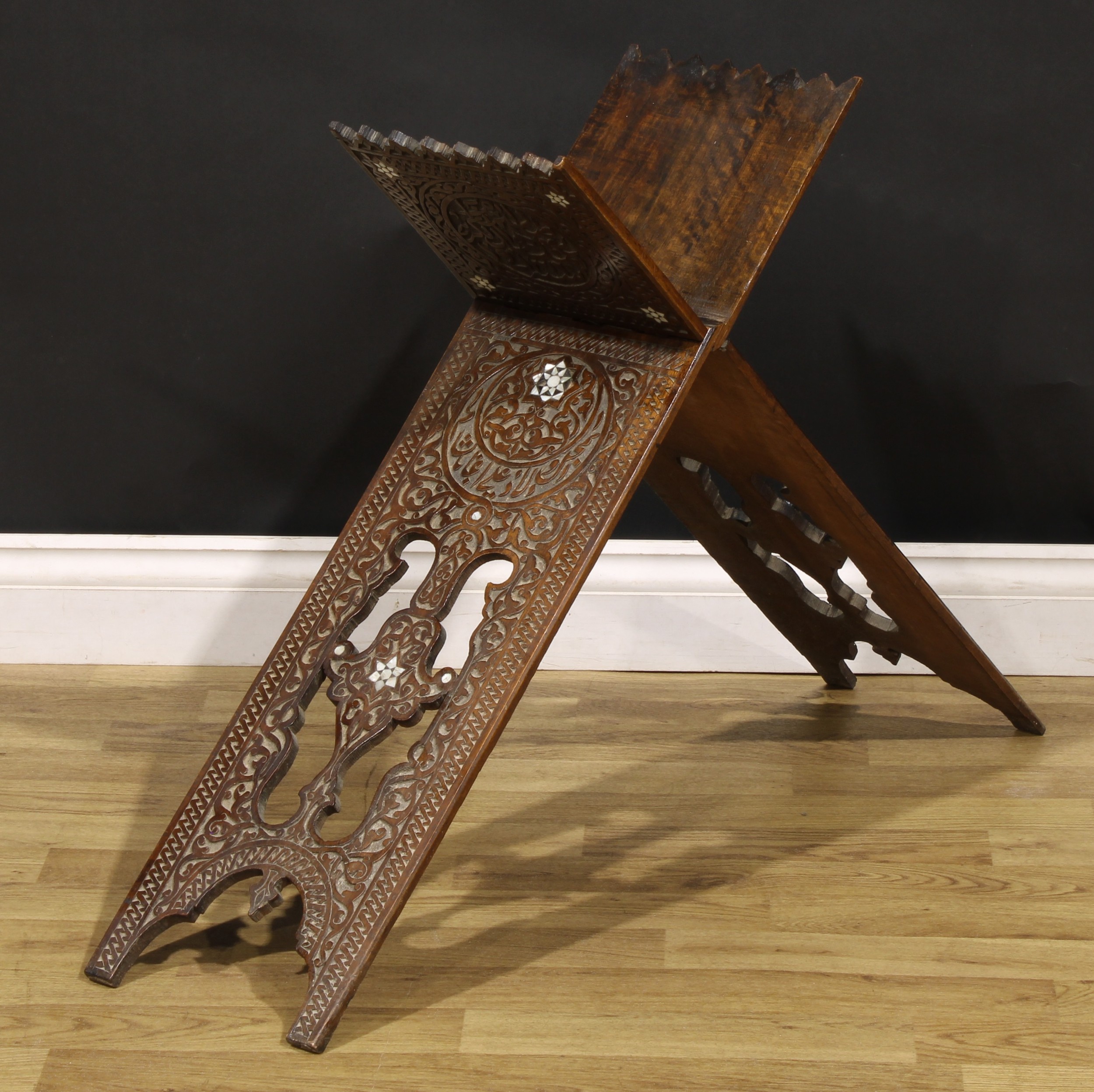 A Middle Eastern hardwood and mother of pearl marquetry folding Koran stand, carved in the Islamic - Image 2 of 2