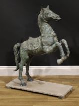 A verdigris patinated garden bronze, cast as a Chinese Tang Horse, stone base, 92cm high