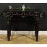 A Chinese hardwood altar table, rectangular top with scroll ends carved with ruyi heads, shaped