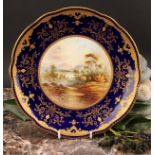 A Coalport Named View shaped circular plate, painted by P. Simpson, signed, In The Grampian Hills,