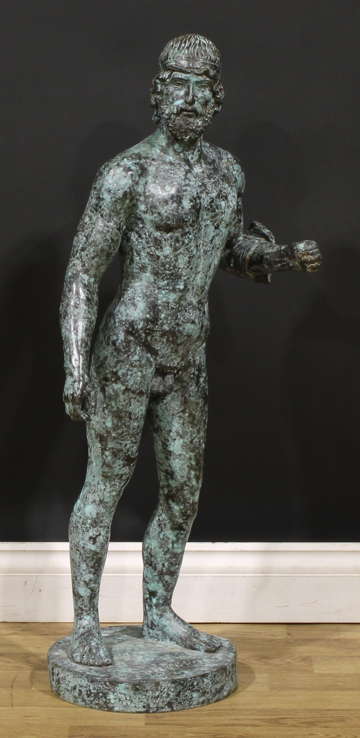 After the antique, a large verdigris patinated bronze figure, Warrior of Riace, signed J Tallsten,