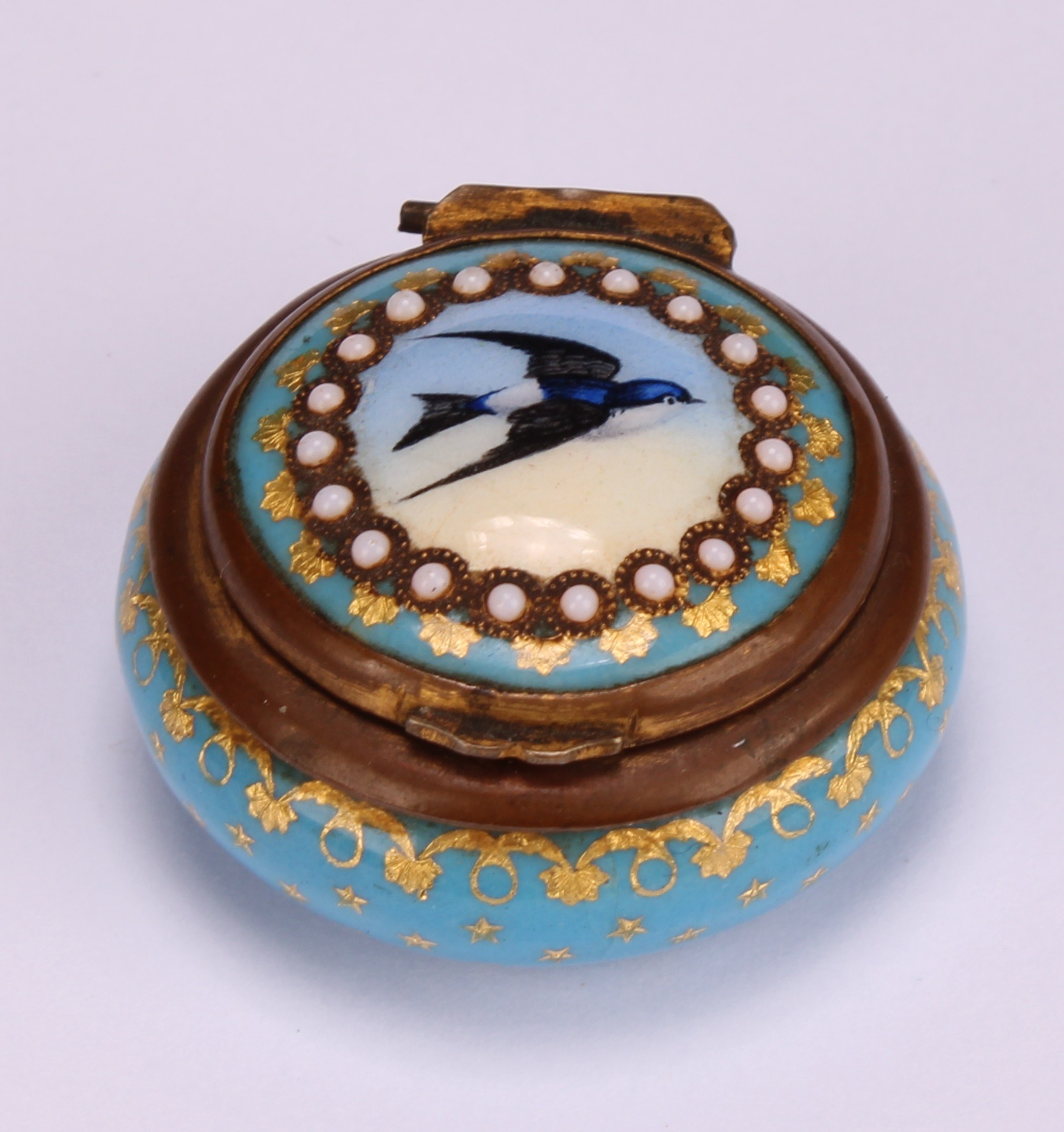 A 19th century French Palais Royal enamel circular rouge box, hinged cover decorated with a swallow, - Image 2 of 5