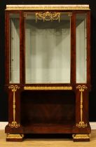 A French Empire Revival gilt metal mounted mahogany display cabinet, marble top above gilt capital