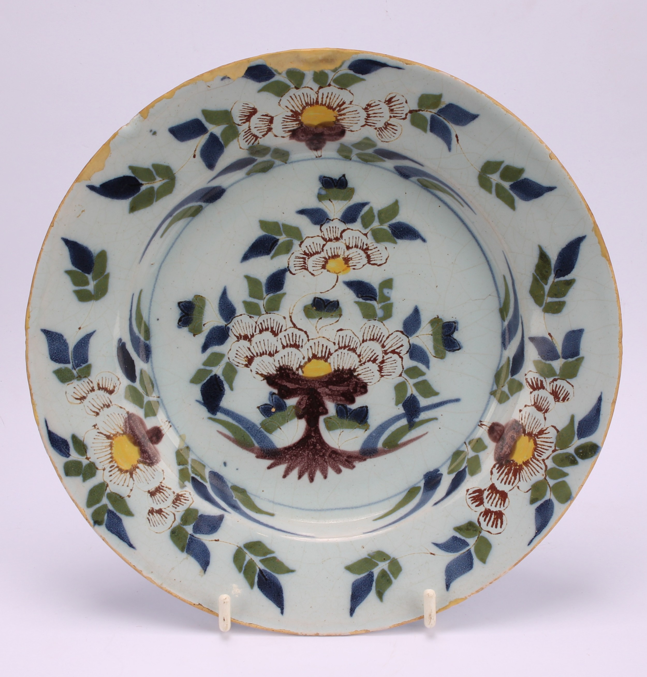 An 18th century Delft circular plate, painted in the chinoiserie taste with a figure in a Chinese - Image 9 of 18