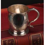 A Scottish Queen Anne silver bell shaped mug, scroll handle, skirted base, 9cm high, Edinburgh 1705,