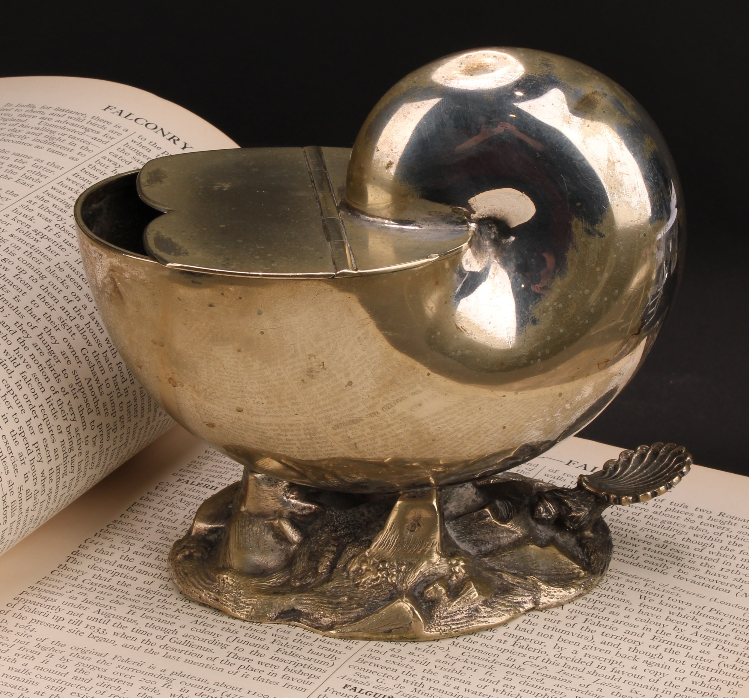 A Victorian E.P.N.S novelty spoon warmer, as a nautilus shell, hinged cover, rocky base, 15cm