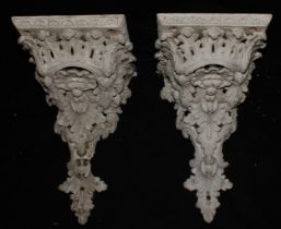 A pair of 19th century gesso wall brackets, moulded throughout with shells and scrolling acanthus,