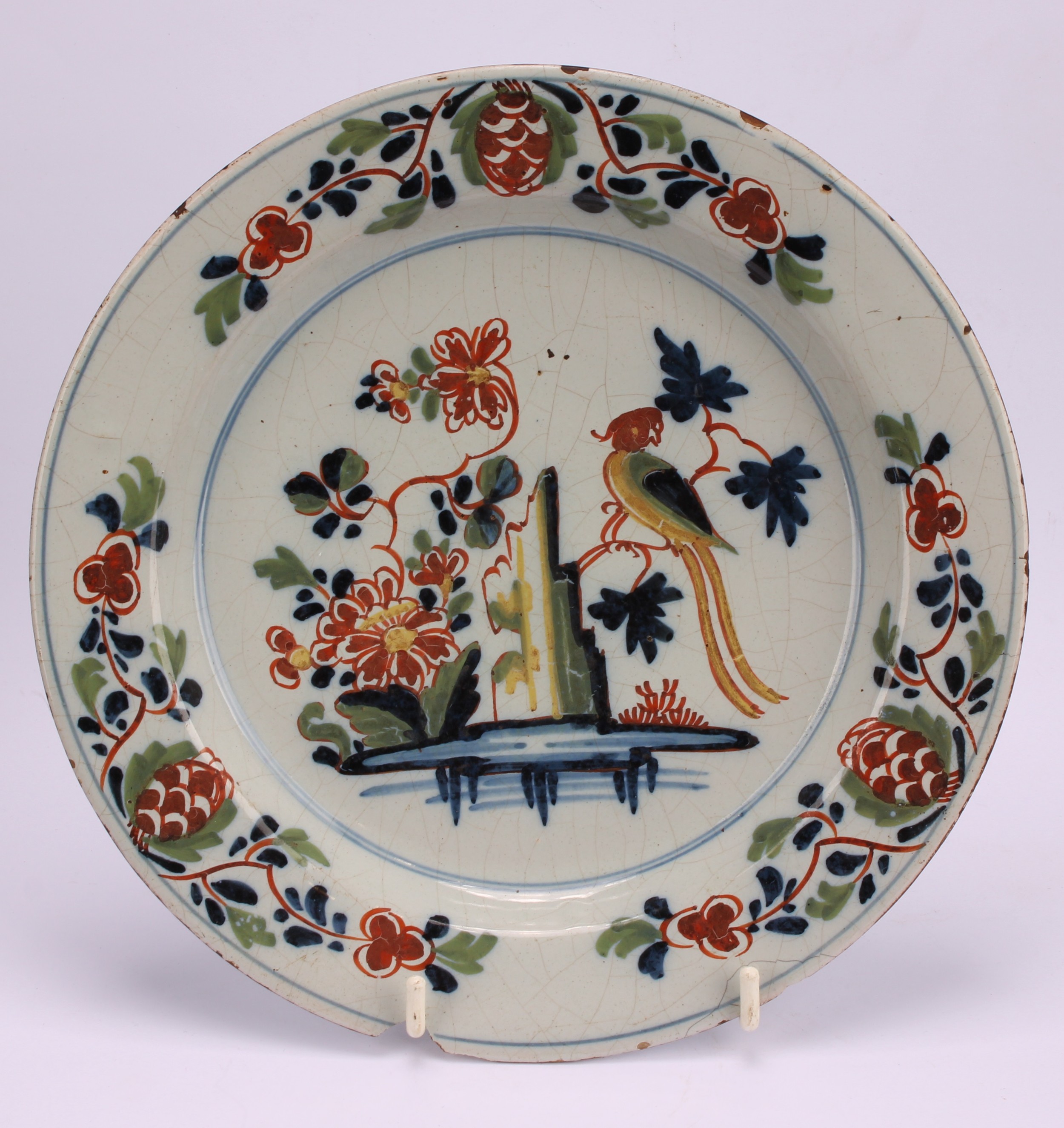 An 18th century Delft circular plate, painted in the chinoiserie taste with a figure in a Chinese - Image 8 of 18