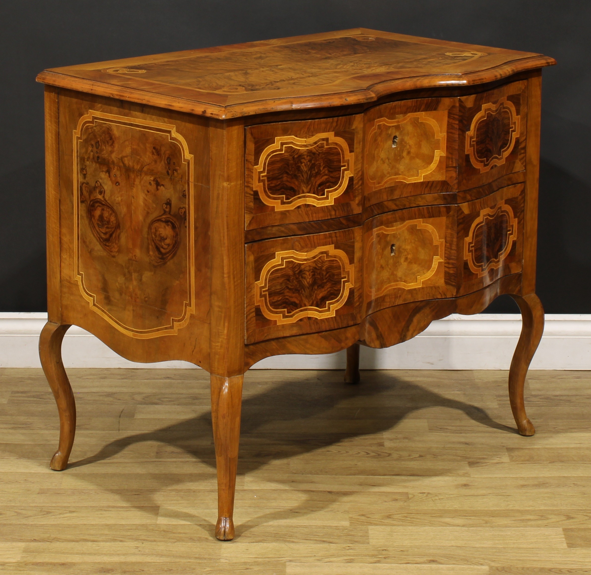 An 18th century style Italian walnut serpentine commode, oversailing top above a pair of long - Image 3 of 6