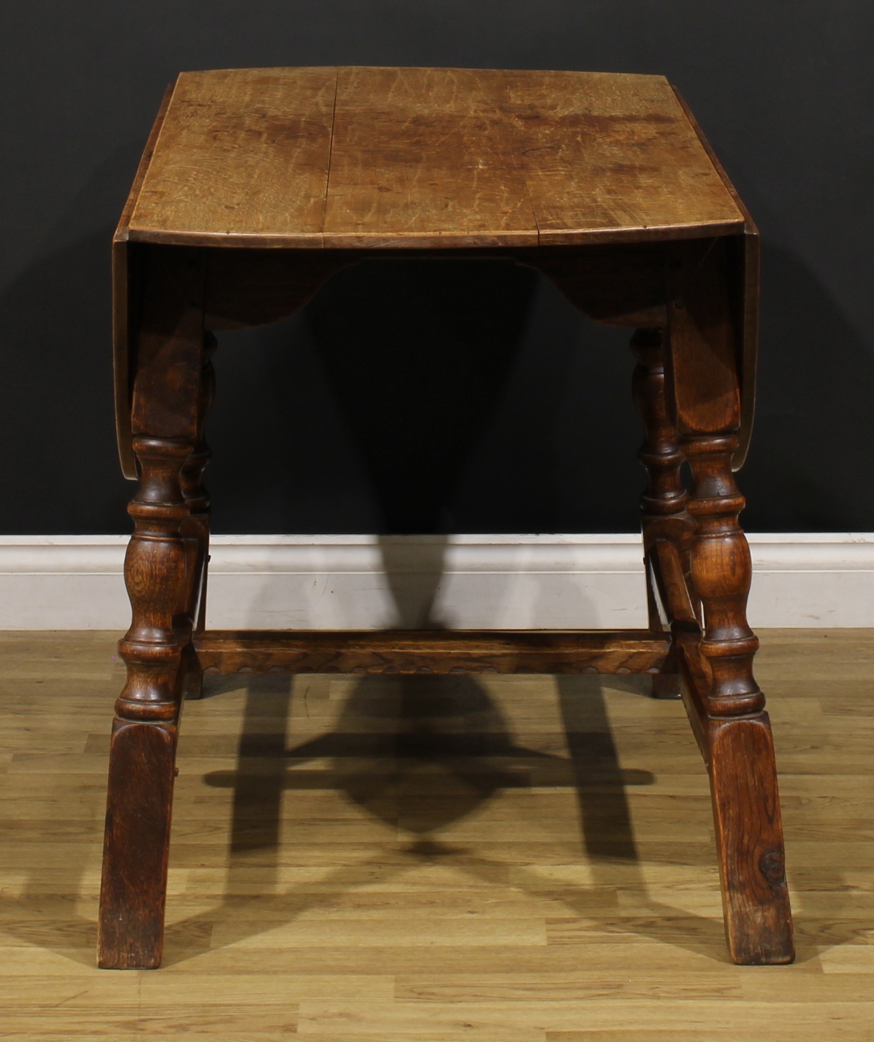 An oak dropleaf dining table, by Rupert/Nigel Griffiths Monastic Woodcraft, 74cm high, 60.5cm - Image 3 of 4