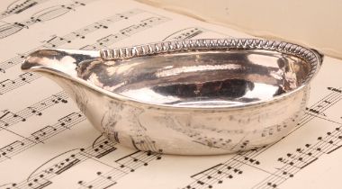 A George III silver pap boat, gadrooned border, 13cm long, London 1801, 60g