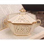 A Graingers Worcester reticulated two handled shaped rectangular box and cover, gilt line borders,
