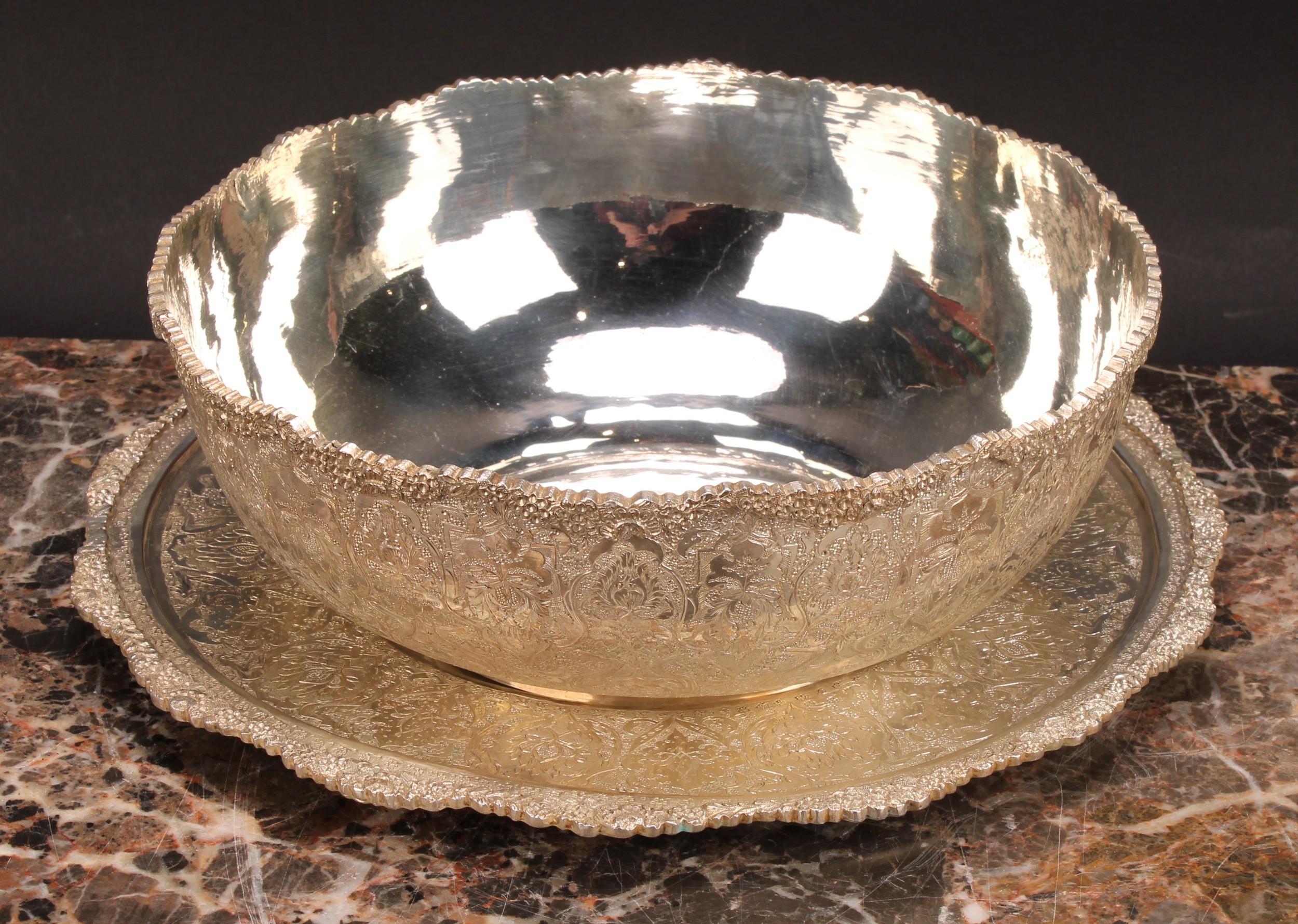 An Iranian white metal fruit bowl and stand, profusely chased in the Persian taste with lotus and - Image 2 of 6