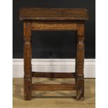 An 18th century oak joint stool, oversailing top above a deep frieze, turned legs, plain stretchers,