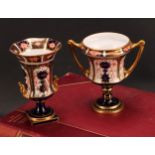 A Royal Crown Derby 1128 Imari pattern campana shaped two-handled octagonal vase, of slender form,