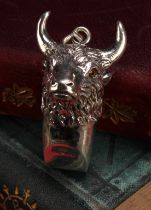 A sterling silver novelty whistle, as a bull's head, 4cm long