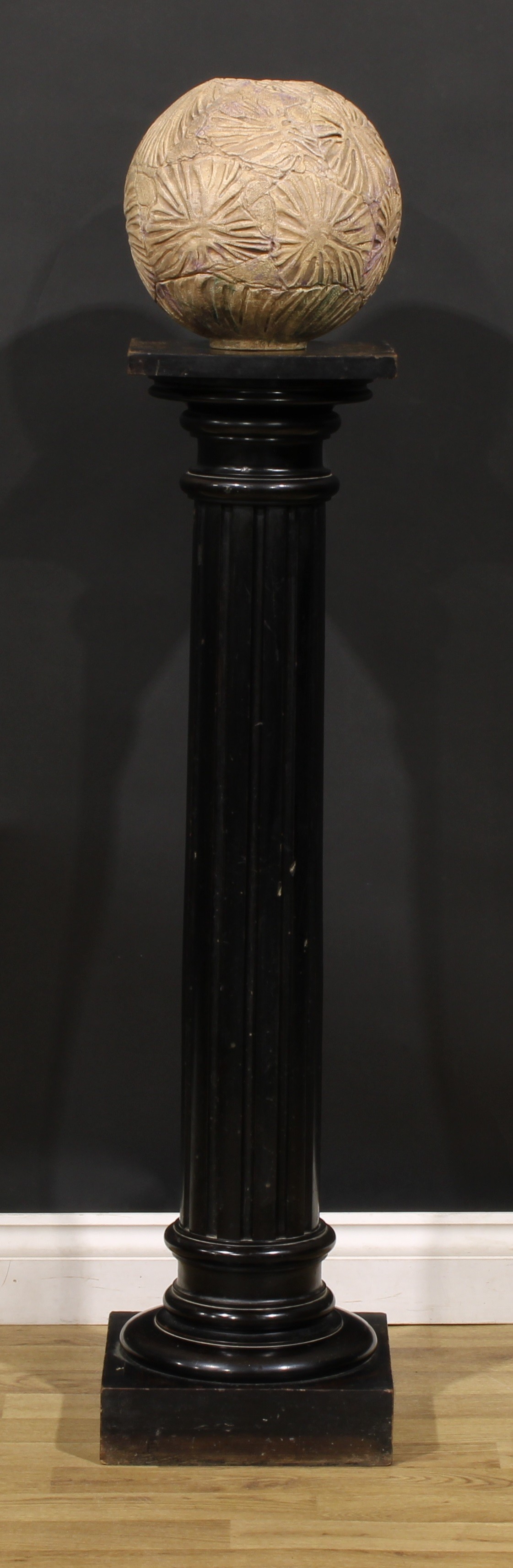 A neoclassical ebonised statuary pedestal, square top, fluted column, square base, 107cm high, the