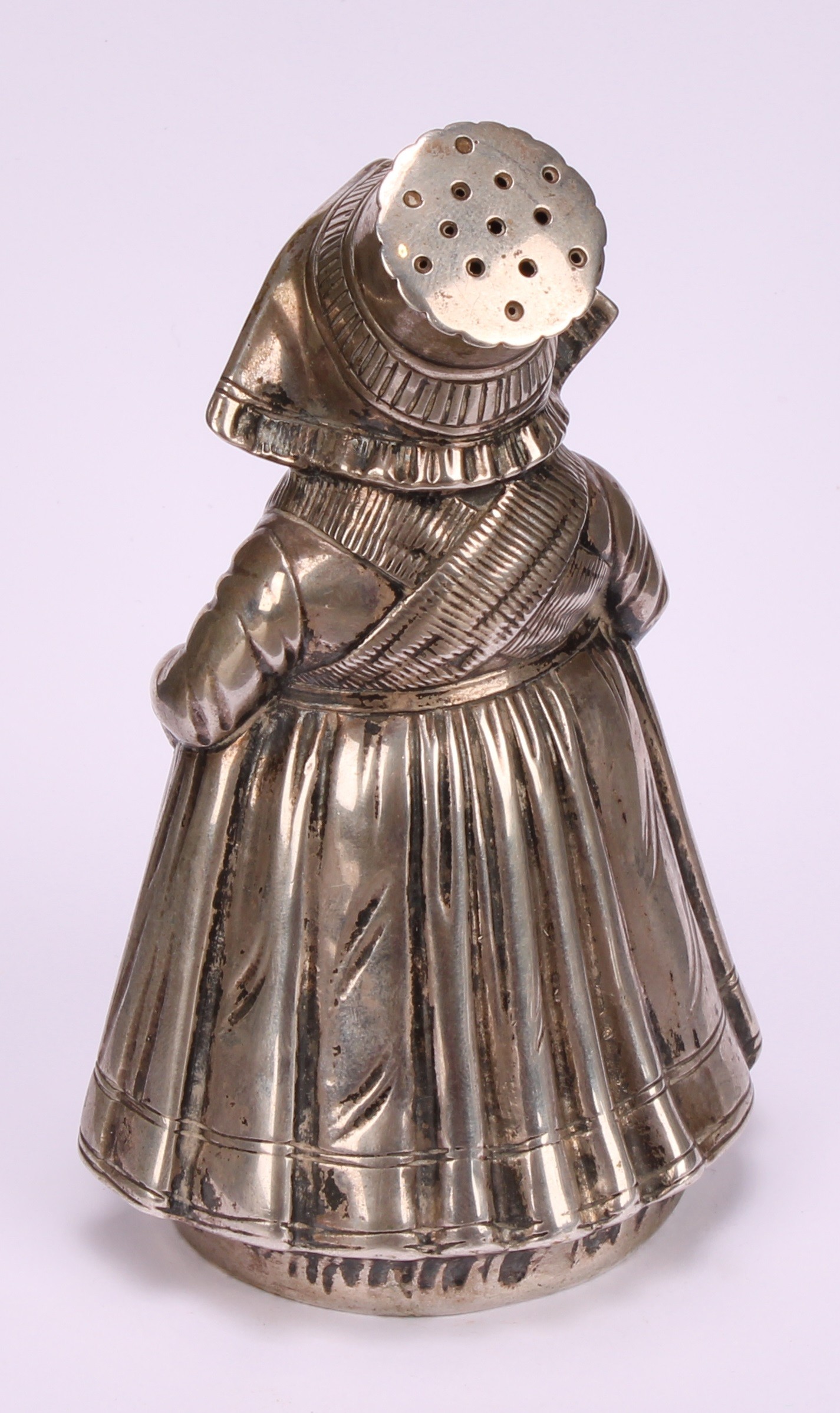 A large German silver novelty pepper, as a young Dutch girl traditionally dressed, 13cm high, - Image 4 of 5