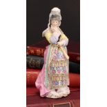 An Edmé Samson & Cie porcelain figure, Précieuse, she stands dressed in the Spanish fashion, 19cm