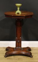 A Victorian Gothic Revival oak pedestal centre table, octagonal top above a dog-tooth frieze,