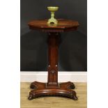 A Victorian Gothic Revival oak pedestal centre table, octagonal top above a dog-tooth frieze,