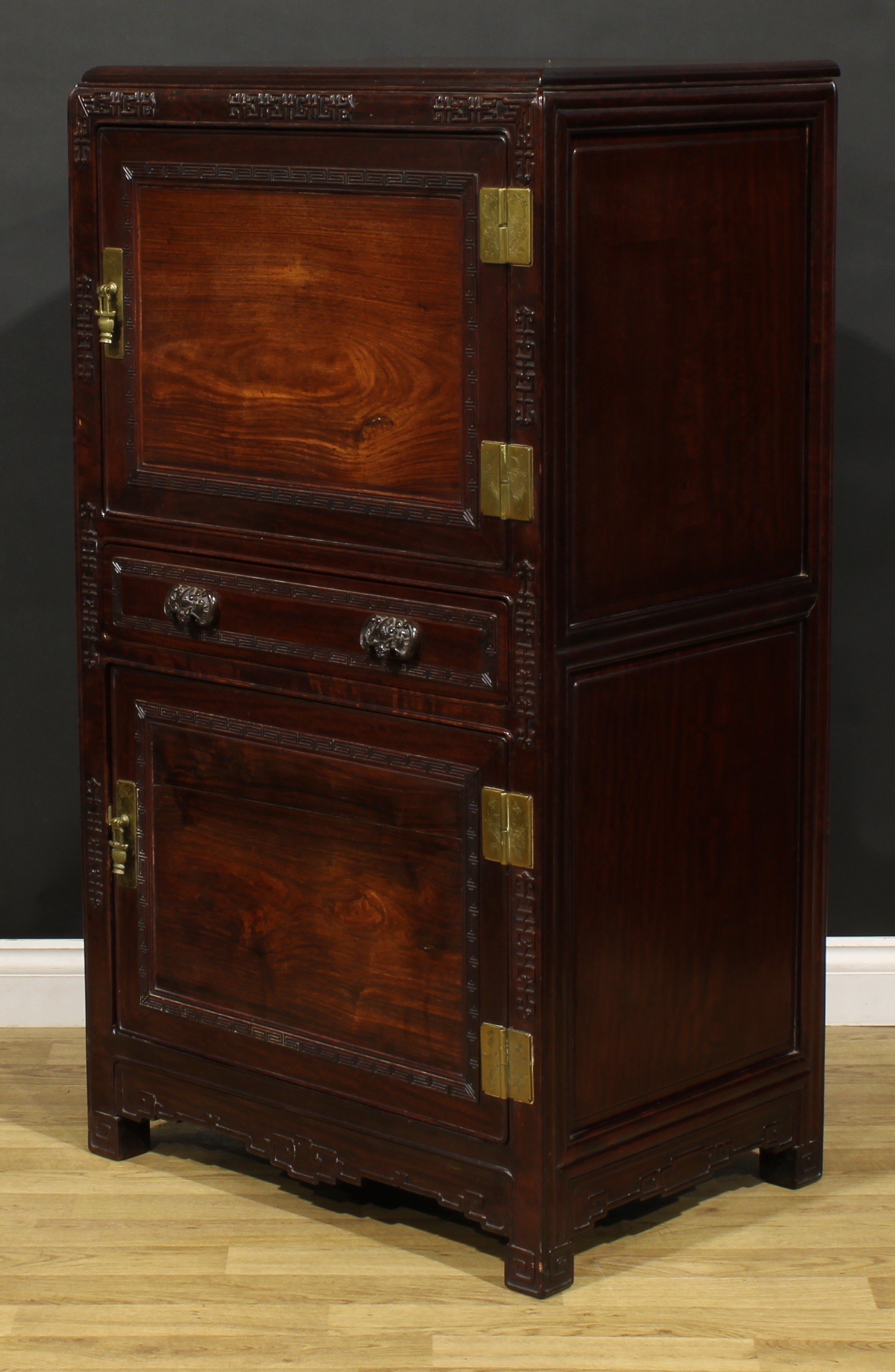 A Chinese hardwood side cabinet, moulded rectangular top above two panel doors centred by a long - Image 4 of 5