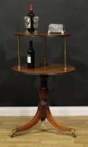 A Regency mahogany two-tier dumbwaiter, circular plateaux with reeded edge, brass columnar supports,